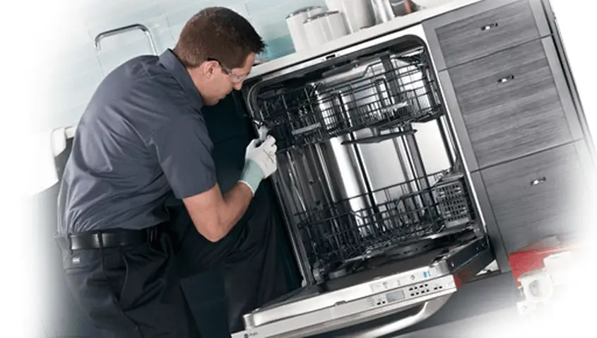 Technician diagnosing dishwasher not starting fault in Brisbane kitchen
